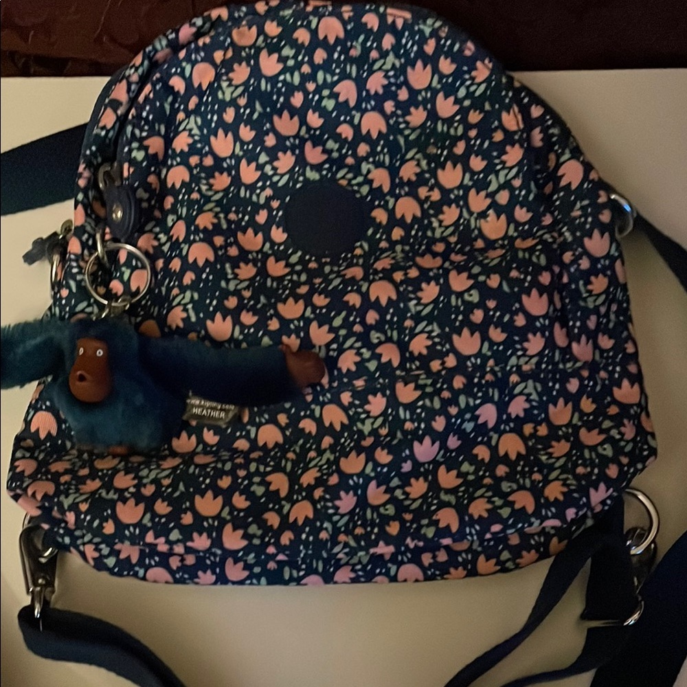 Kipling Floral Backpack-Blue and Pink with monkey keychain 
L-12”. Width 10 1/2”